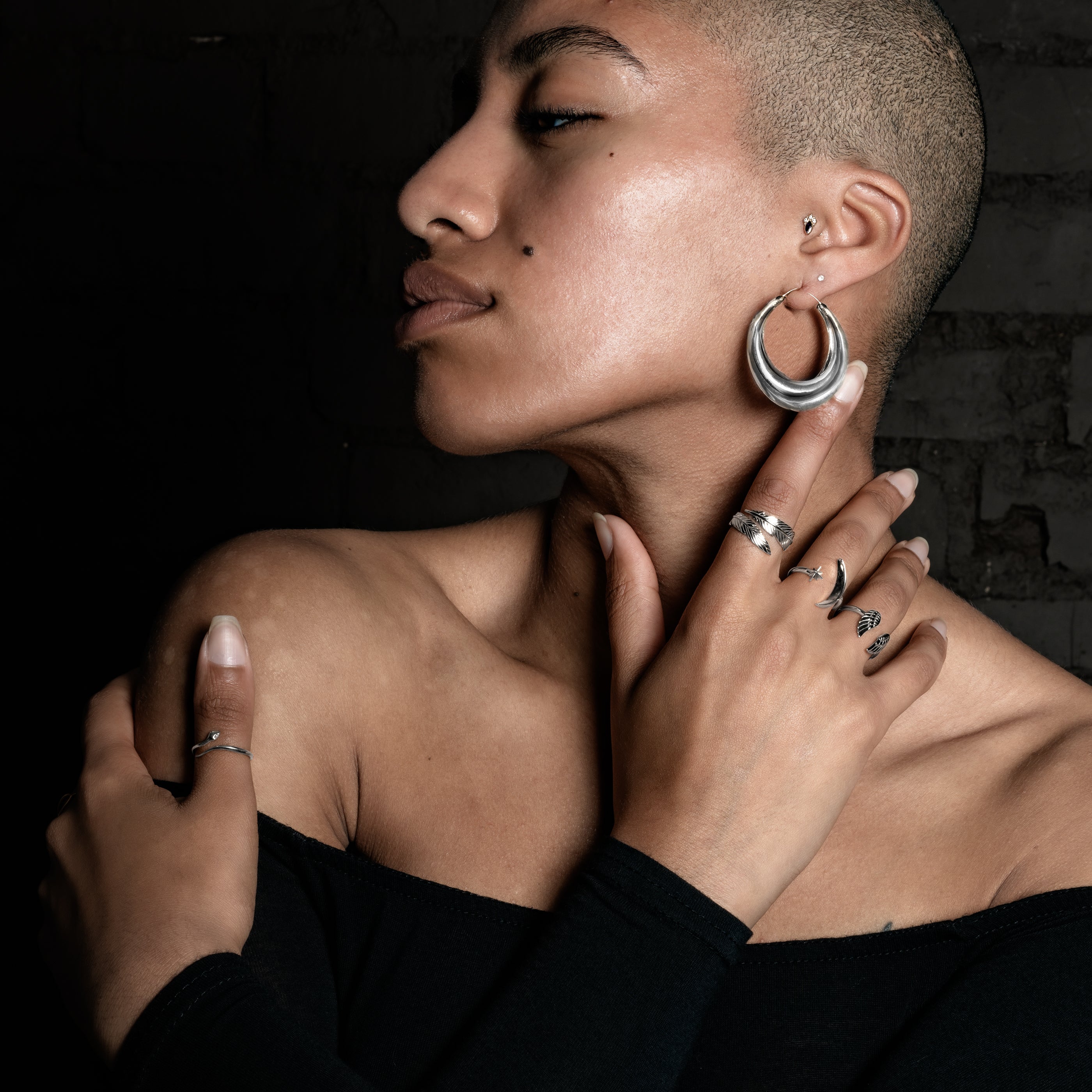 model wearing. Silver Glow Hoop Earrings