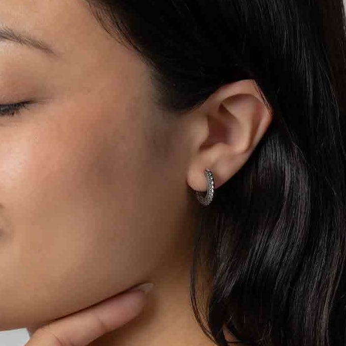 model wearing Sterling Silver Dragon Scale Huggies hoops