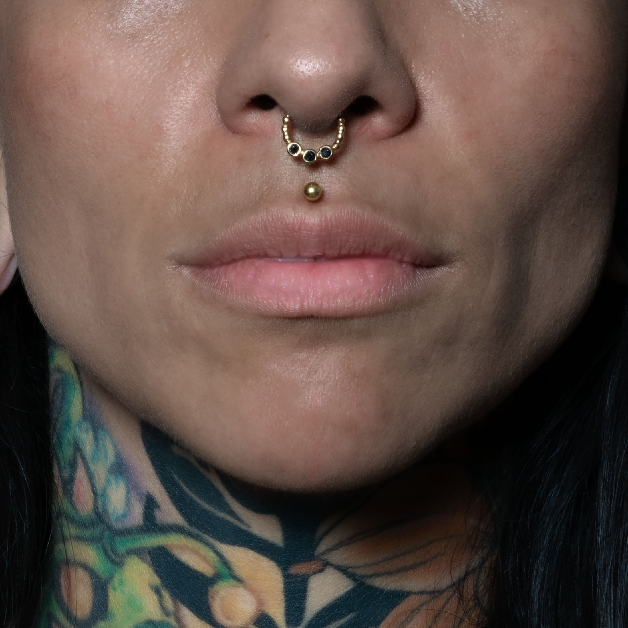 model wearing Trio Black Spinel Gold Septum