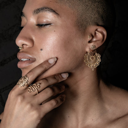 model wearing Vinyasa Mandala Studs, Vinyasa earrings, 14k gold moon labret, snake ring and padma ring