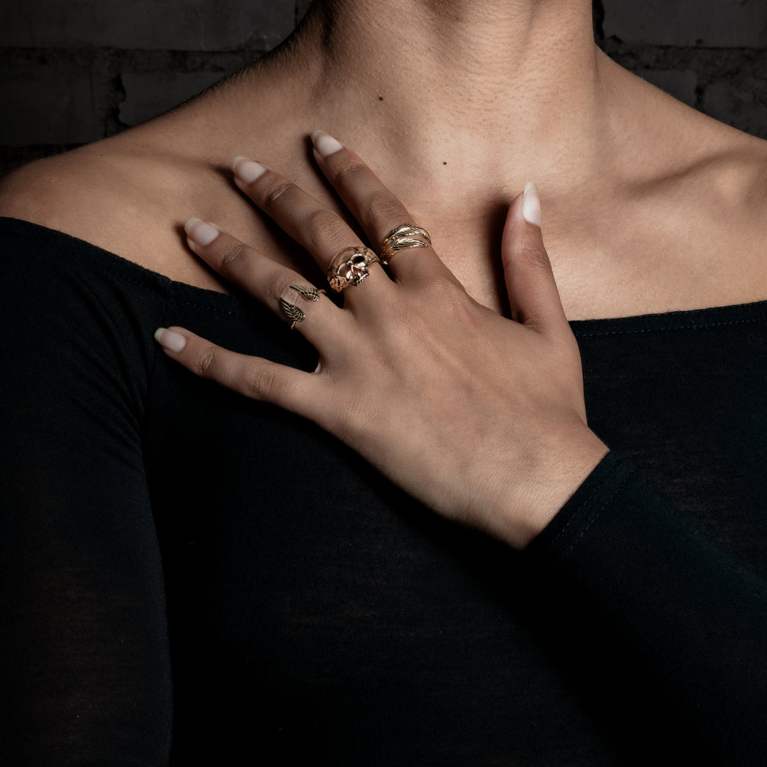 model wearing Immortal Ring, feather ring and wing ring