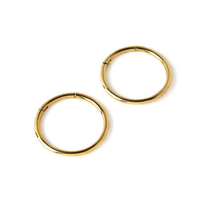pair of gold brass stacking hoop gauge earrings side view