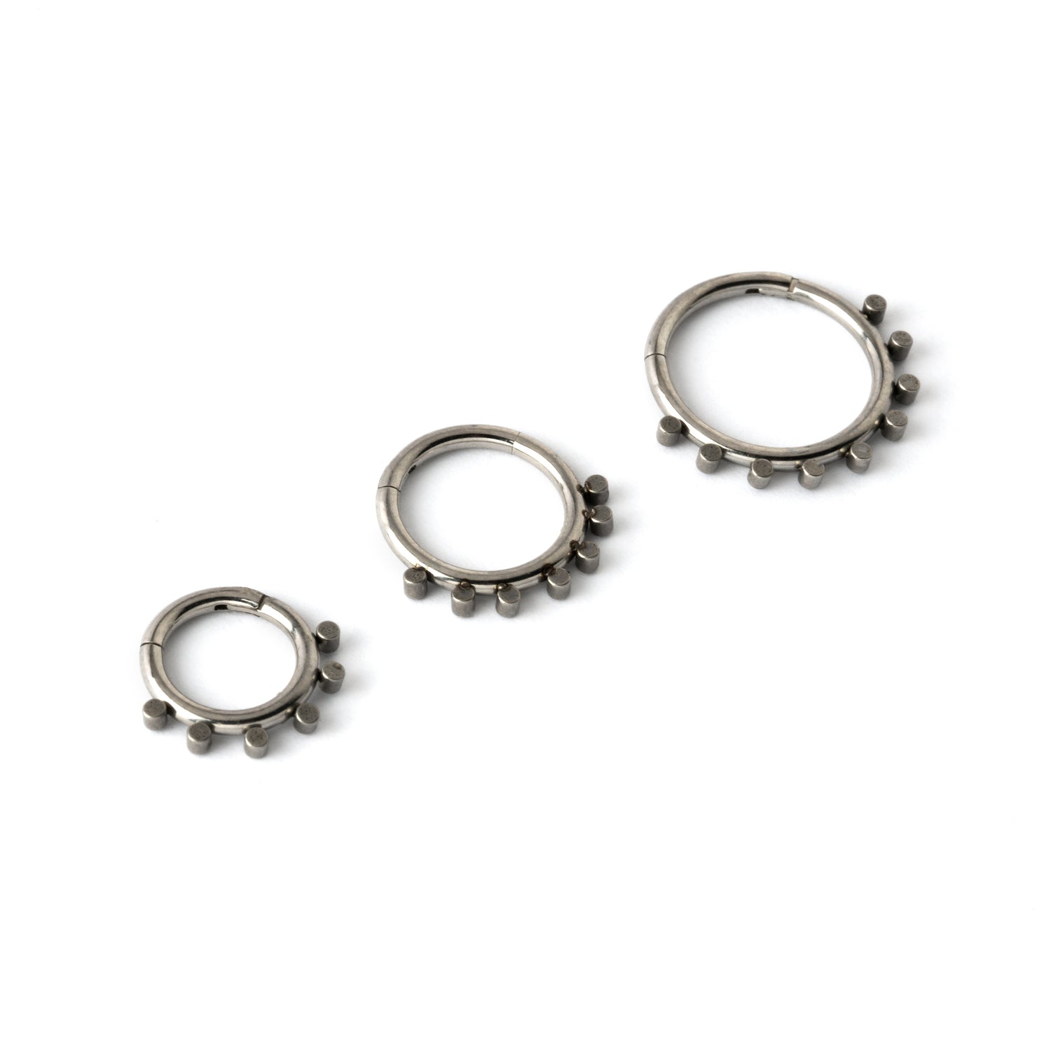 elegant and minimalist 6mm, 8mm and 10mmsurgical steel piercing clicker rings with geometric spheres