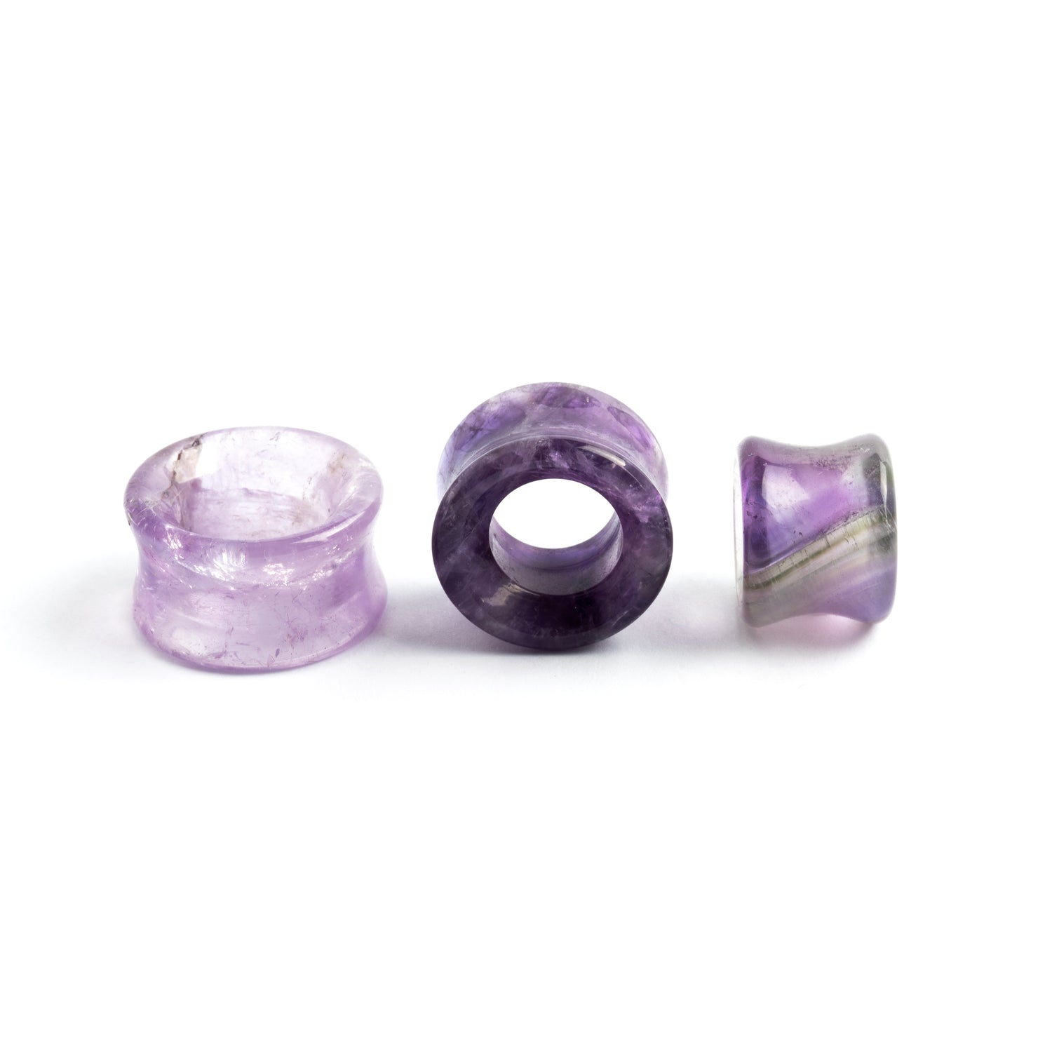 several sizes of Amethyst double flare stone ear tunnel front and side view