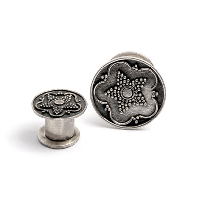 two sizes of Antique Silver Plug Tunnel with star ornament and a screw on closure