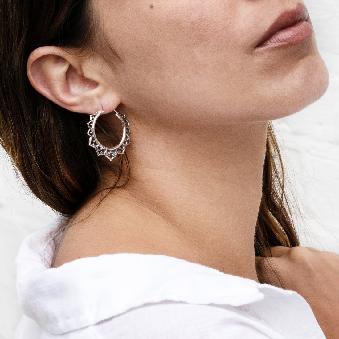 model wearing Aqua Lotus Silver Hoop earrings