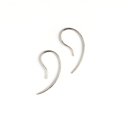 pair of silver wire tiny hook earrings side view