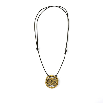 Golden Auryn Pendant on a cotton string frontal view