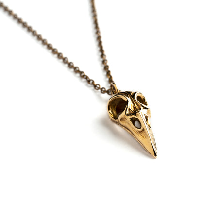Bronze raven skull necklace right side view
