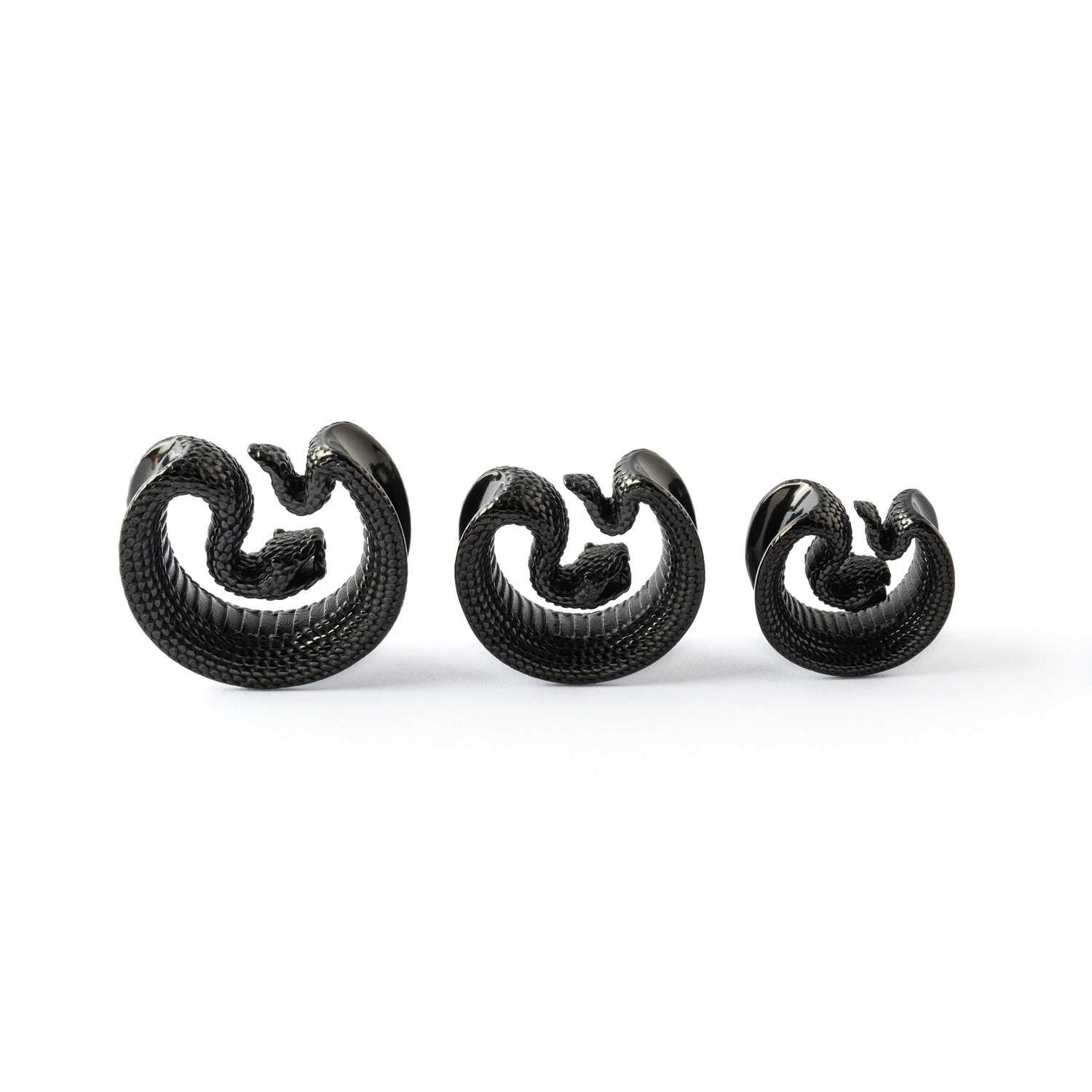 different sizes of black Python surgical steel plug tunnel frontal view