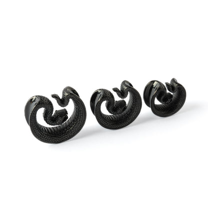 different sizes of black Python surgical steel plug tunnel