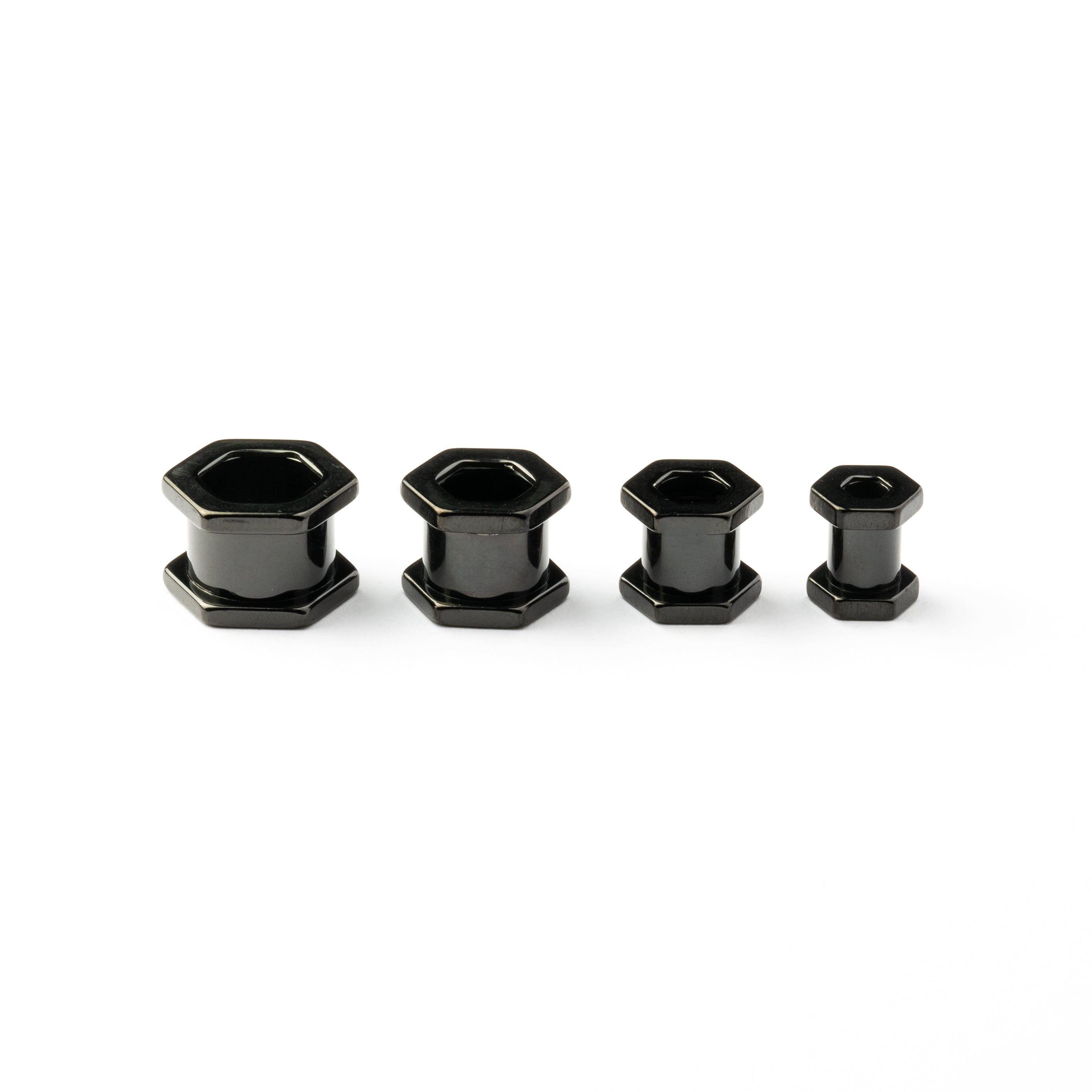 several sizes of surgical steel black hexagon ear tunnels side view