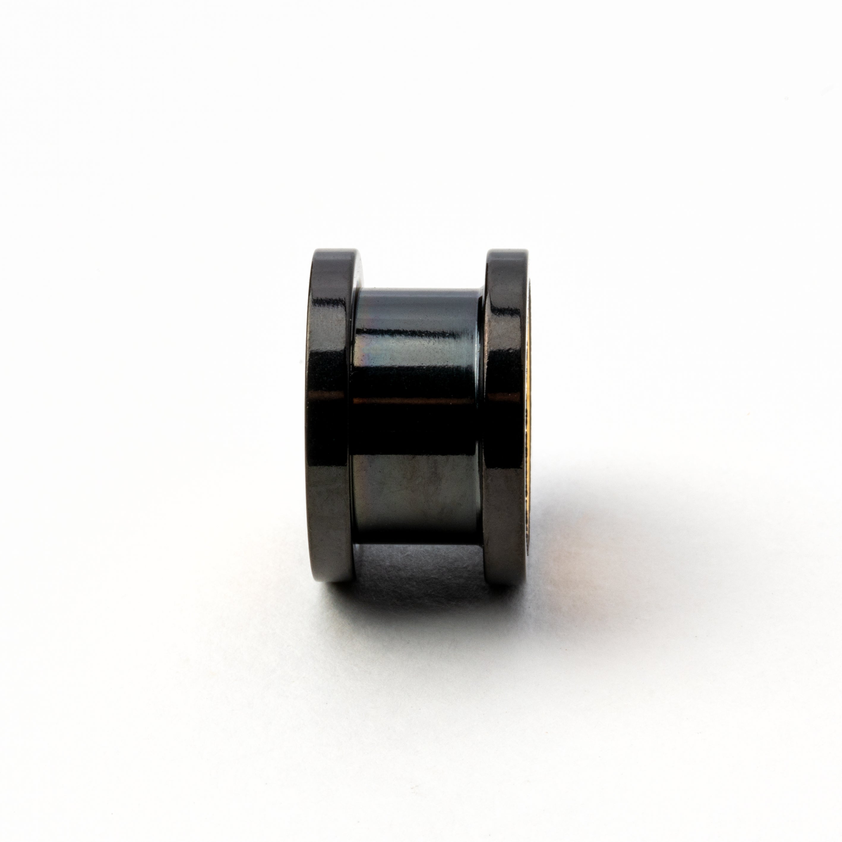 single black and gold surgical steel ear tunnel side view