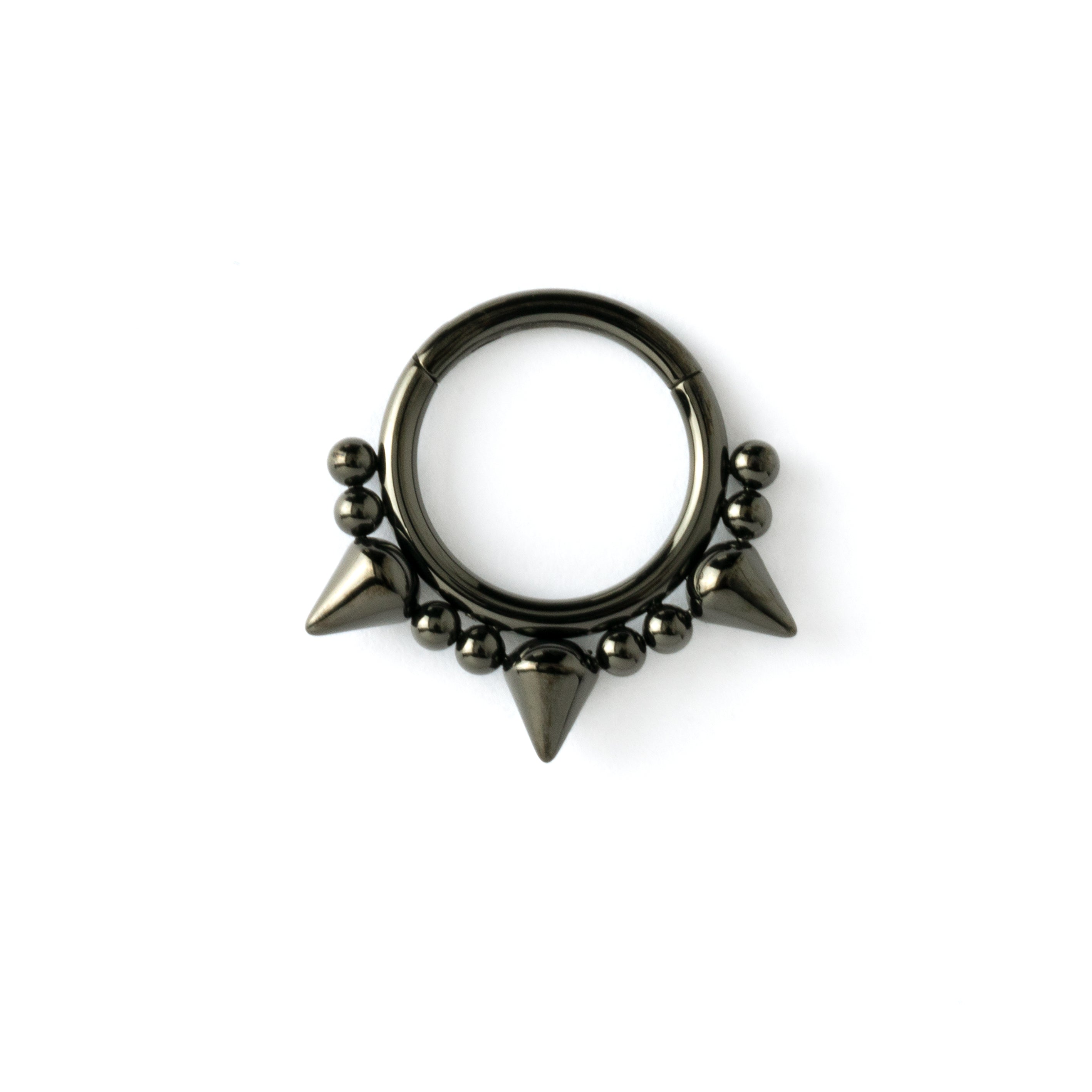 shiny black surgical steel clicker ring ornamented with spheres and spikes frontal view