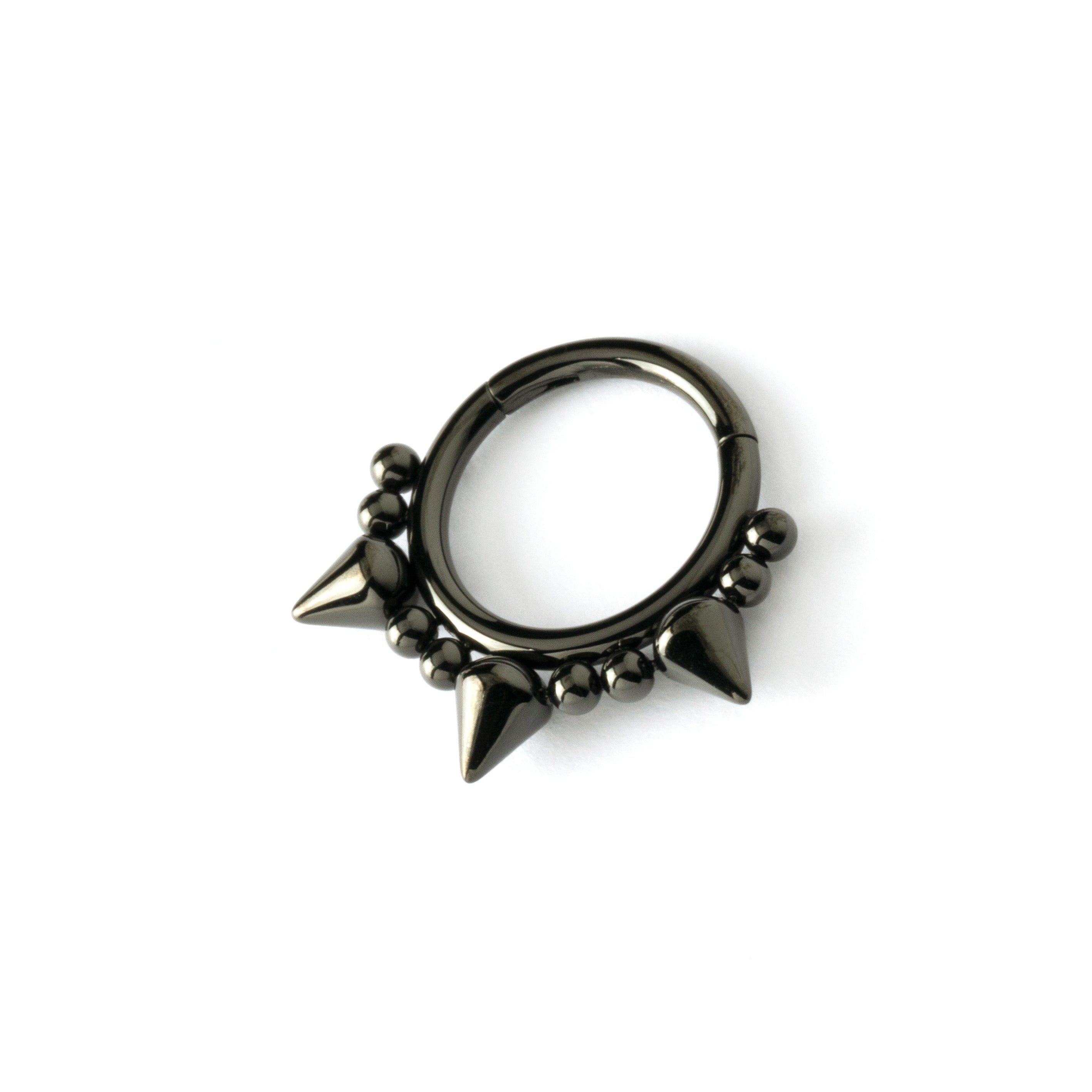 shiny black surgical steel clicker ring ornamented with spheres and spikes left side view