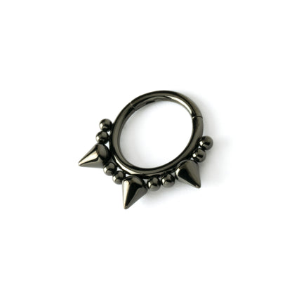shiny black surgical steel clicker ring ornamented with spheres and spikes left side view