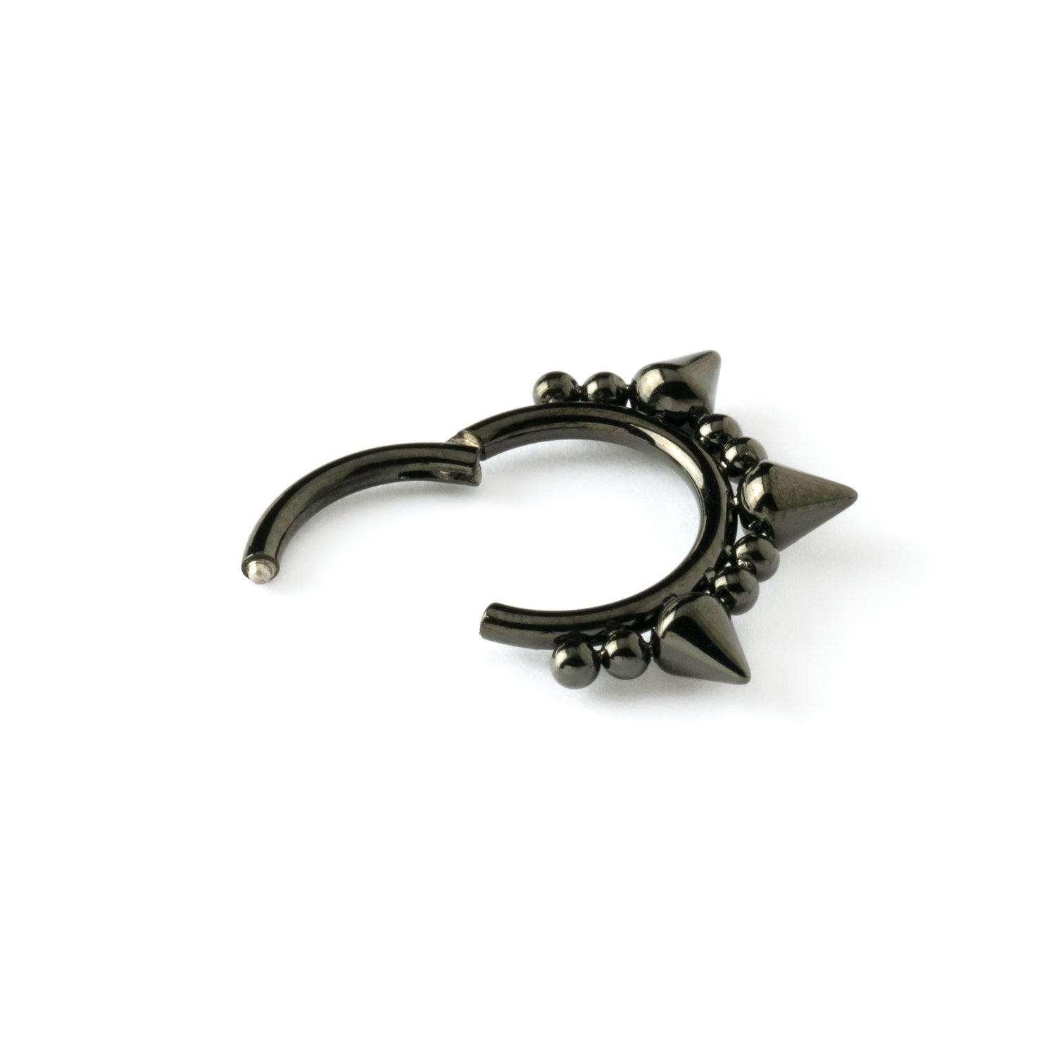 shiny black surgical steel clicker ring ornamented with spheres and spikes closure view