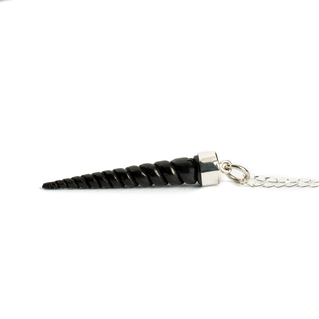 Blackwood unicorn tusk pendent on a silver chain side view