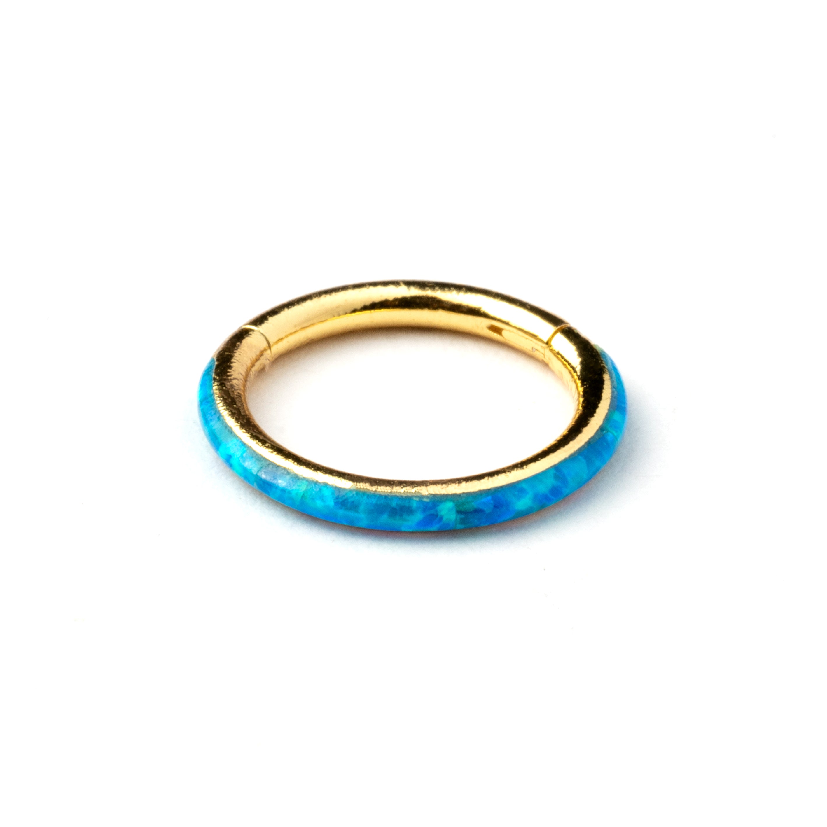 Gold surgical steel septum clicker ring with blue opal inlay frontal view