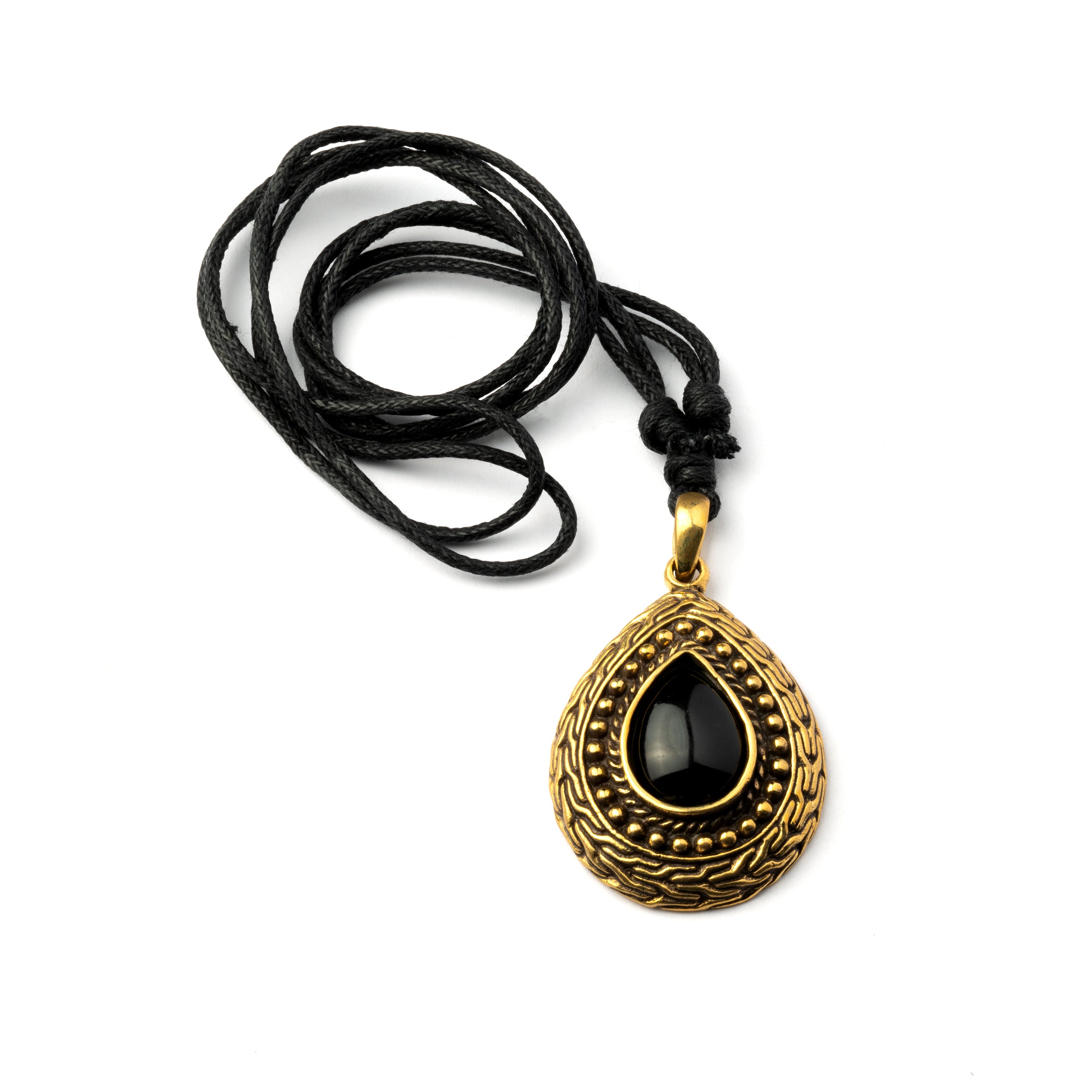 Teardrop shaped pendant with black Onyx stone encircled by Celtic ornaments. Black Onyx is a crystal to guide your spiritual journey by bringing the true reflection of your soul.   Material: Brass, Black Onyx Nickel, cadmium and lead free. Dimension: H 40mm , W 30mm Comes on an adjustable black cotton string.