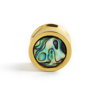 single golden brass ear plug with abalone inlay frontal view