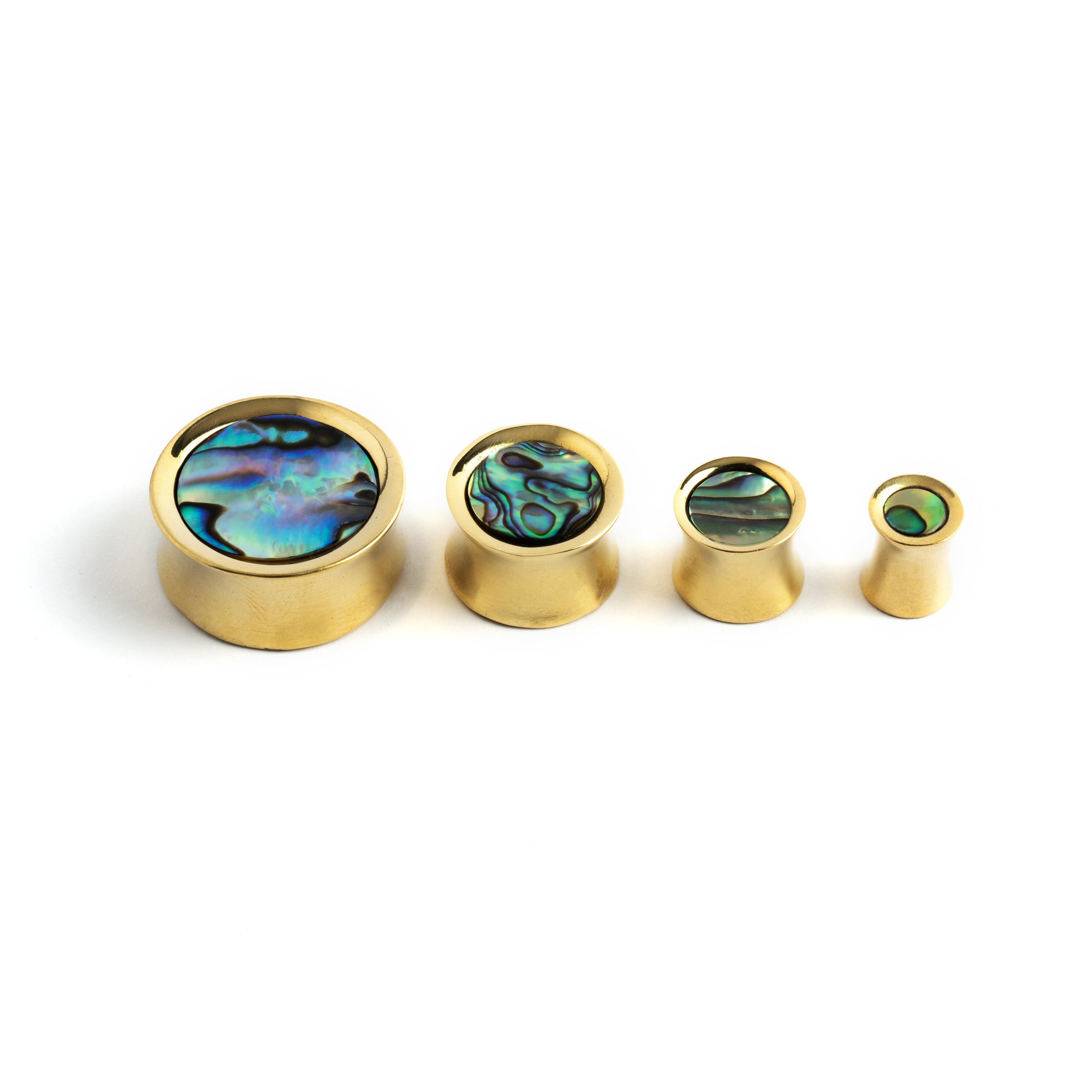 several sizes of golden brass ear plugs with abalone inlay front side view