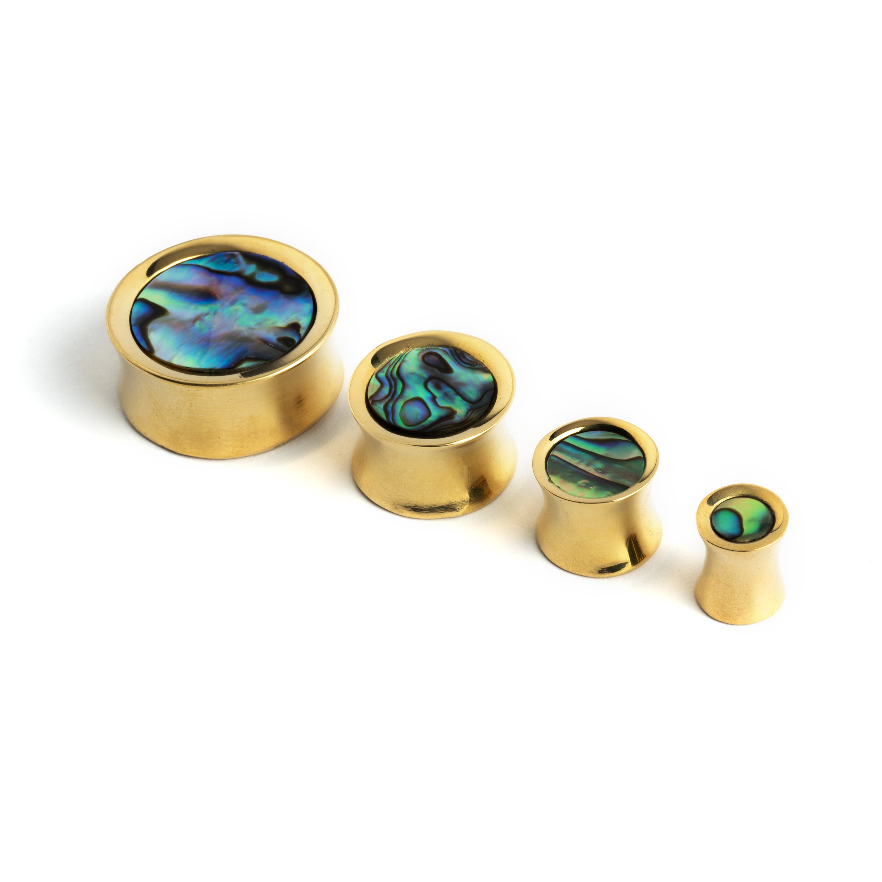 several sizes of golden brass ear plugs with abalone inlay front view