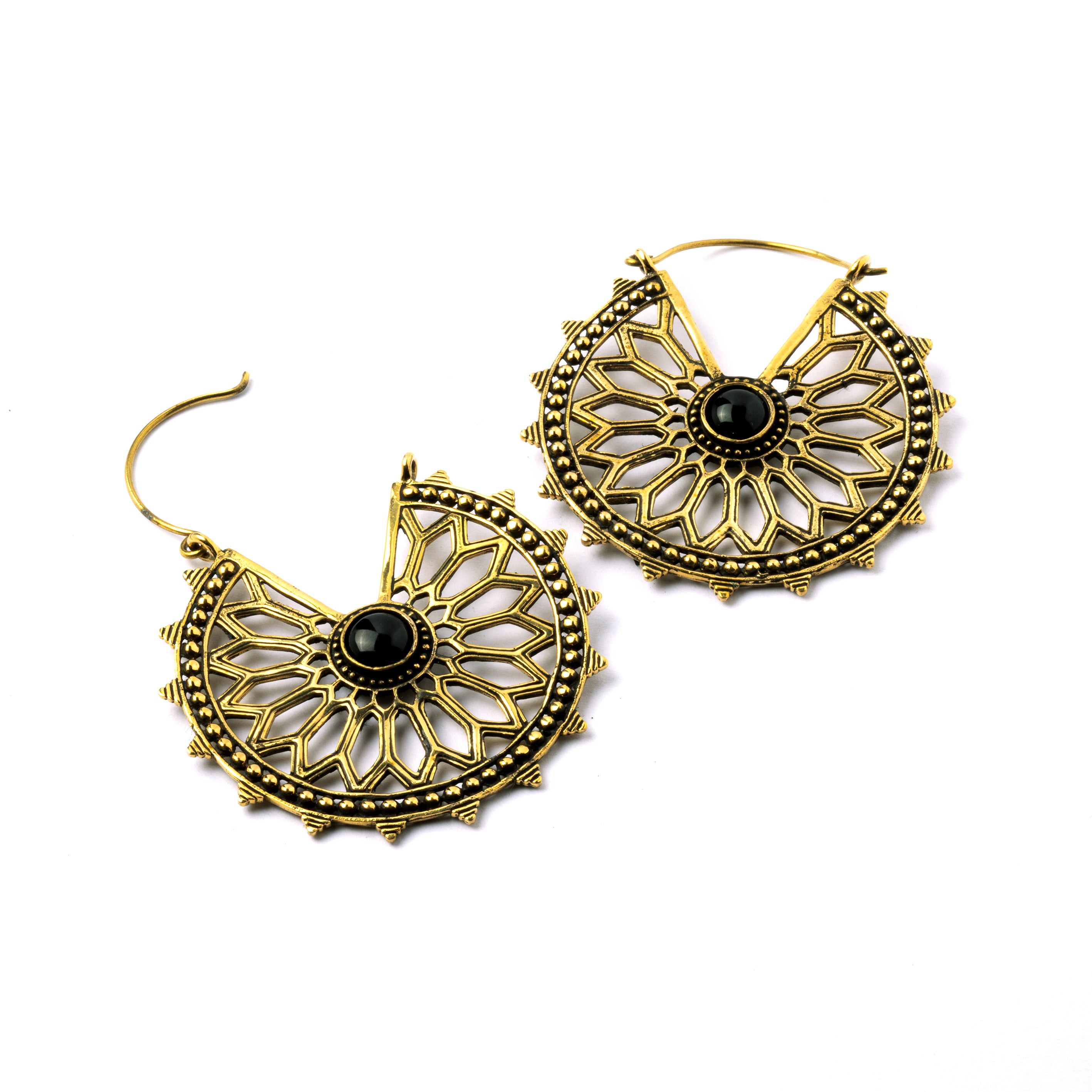 pair of golden brass geometric flower earrings with black onyx closure side view