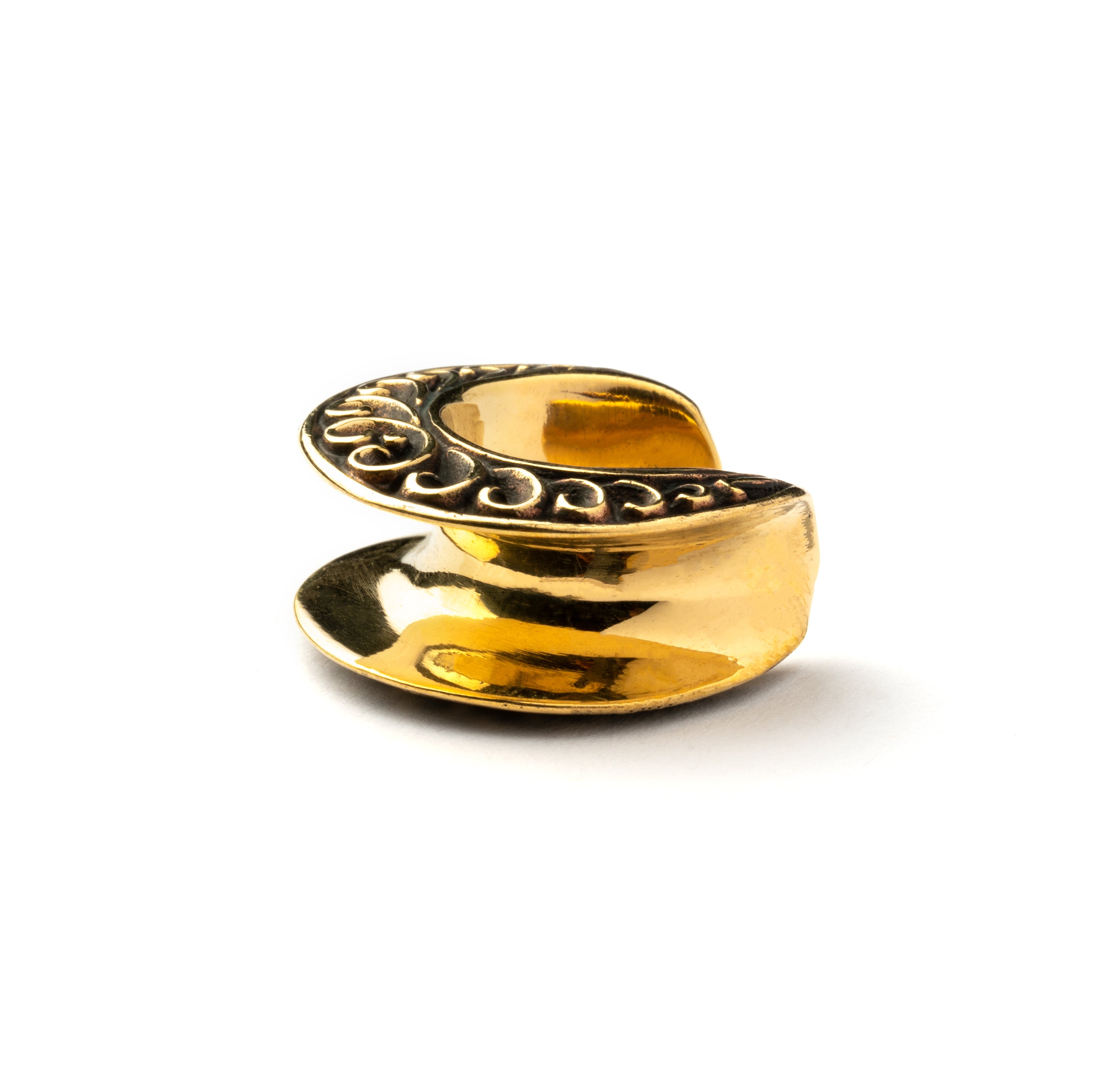 single golden brass ear saddle with curved ornaments side view