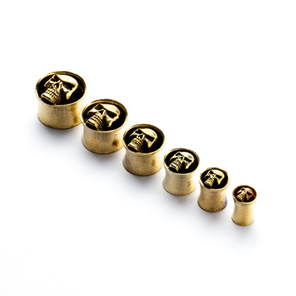 Brass skull ear plugs front and side view