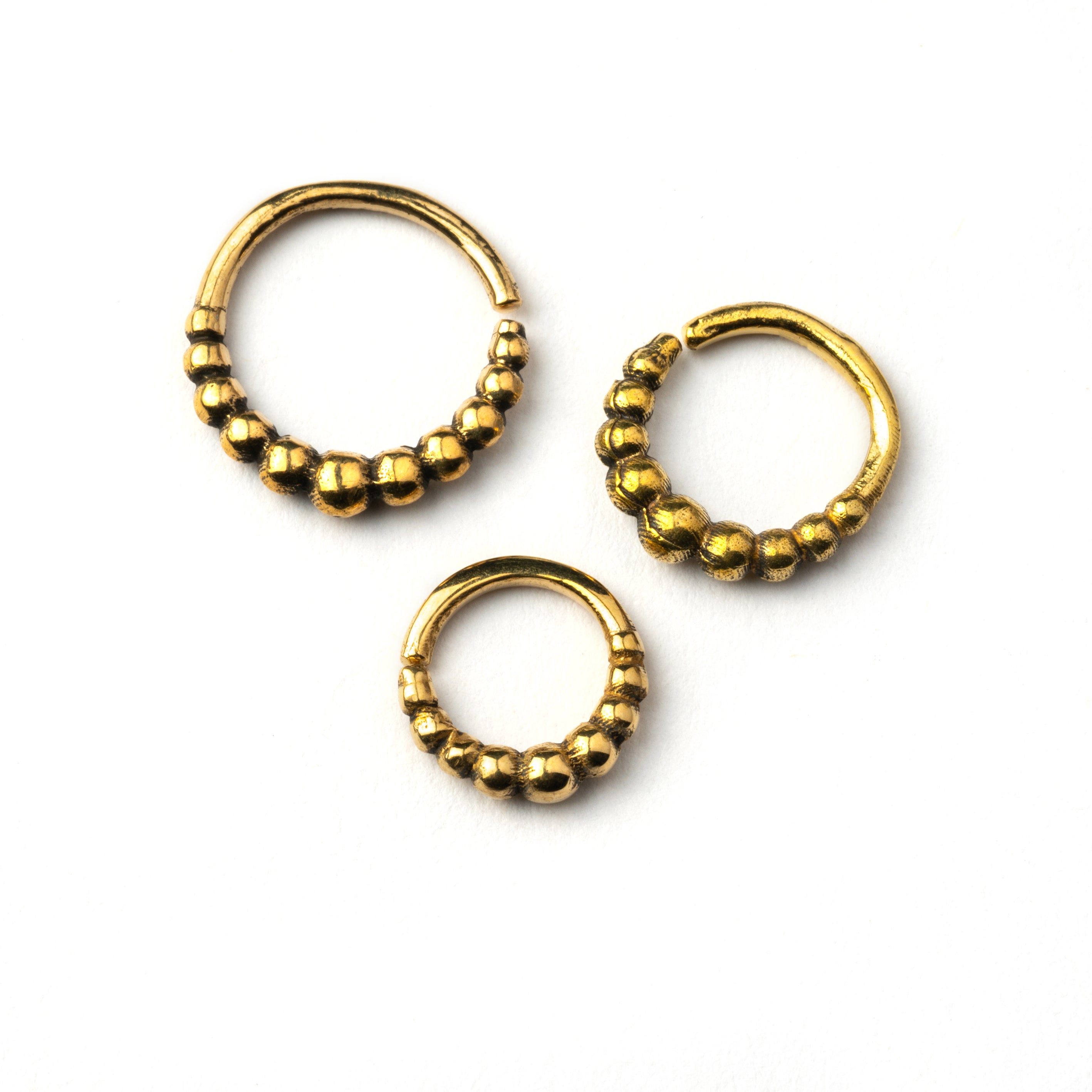 6mm, 8mm, 10mm Mouji golden brass septum rings frontal view