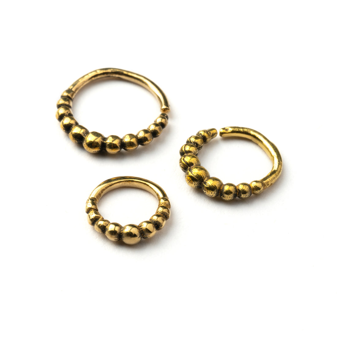 6mm, 8mm, 10mm Mouji golden brass septum rings frontal view