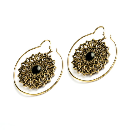 pair of golden brass large flower mandala earrings with centred black onyx right side view