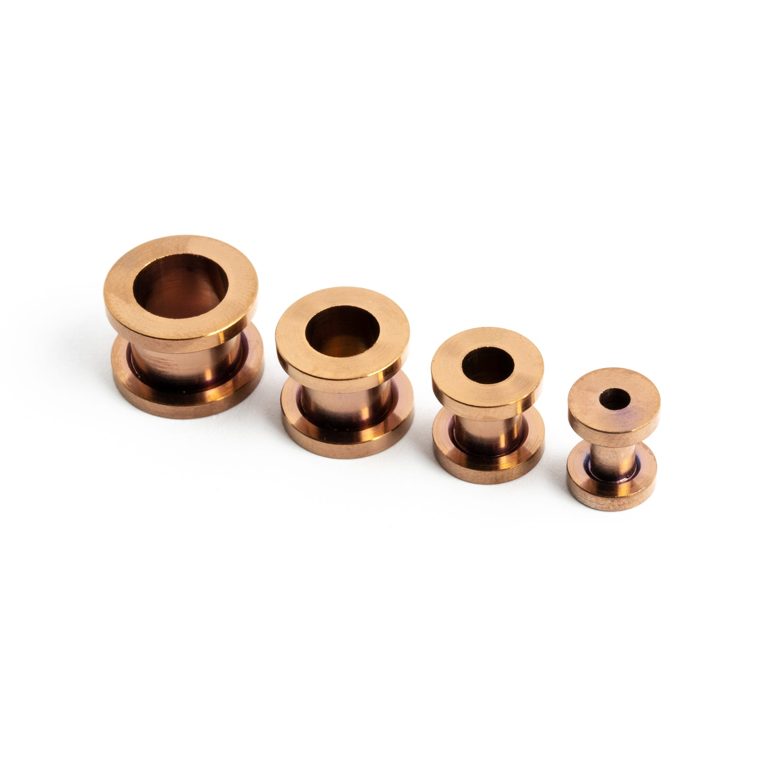 several sizes of bronze surgical steel ear tunnels with double flared ends front right view