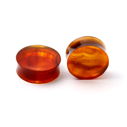 pair of Burmese Amber double flare stone ear plugs front and side view