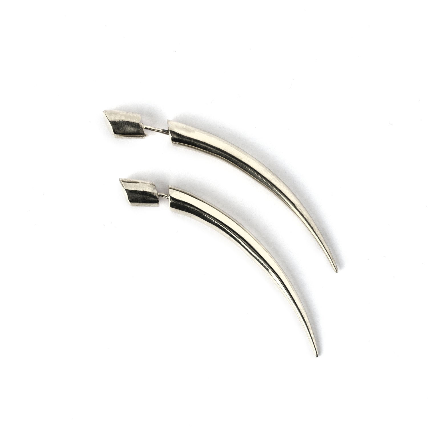 pair of silver curved spike fake gauge earring frontal view