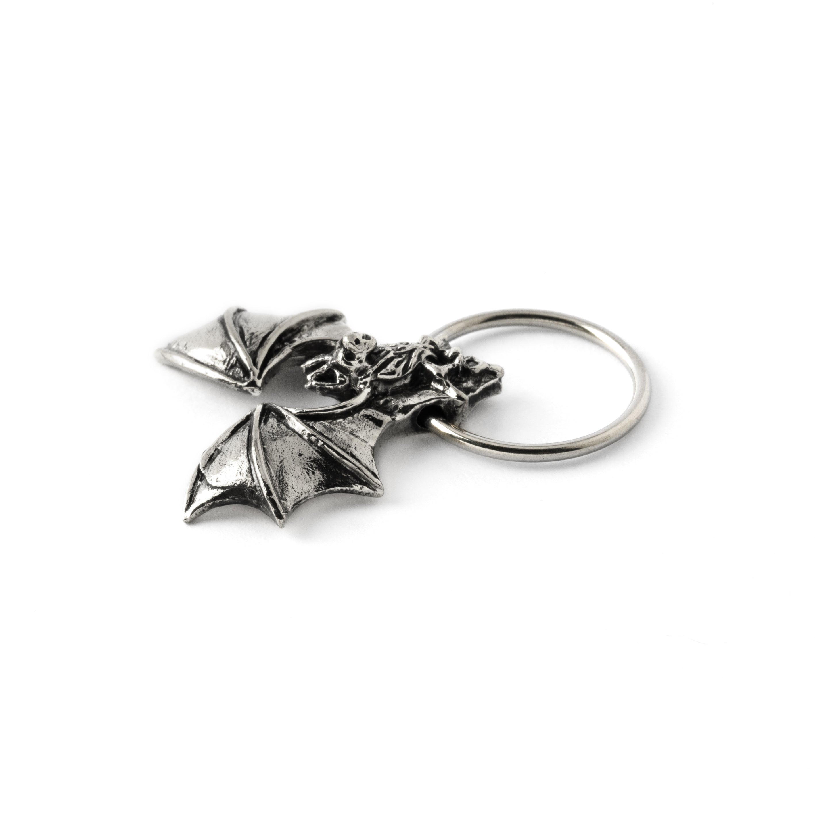 surgical steel finely detailed bat piercing ring close up view