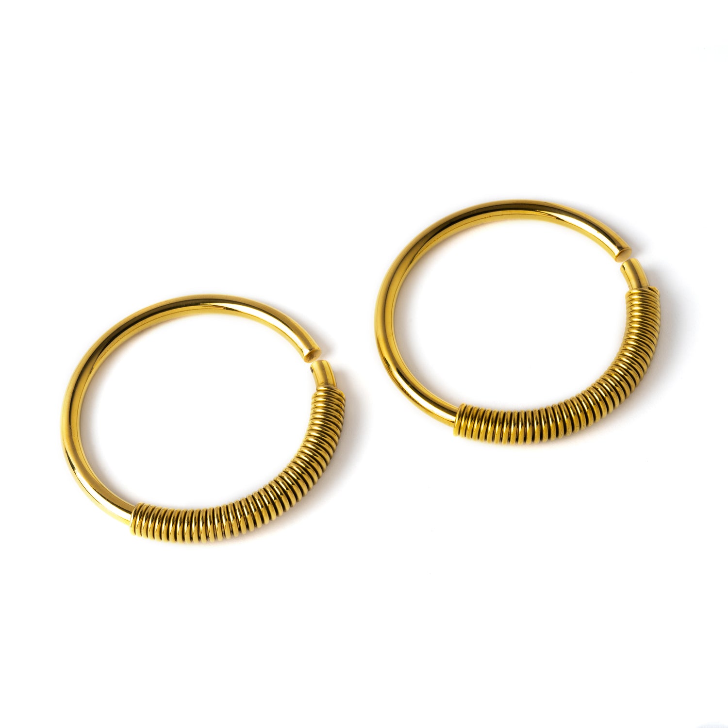 pair of gold brass large hoops gauges with coiled wire ornament right front view