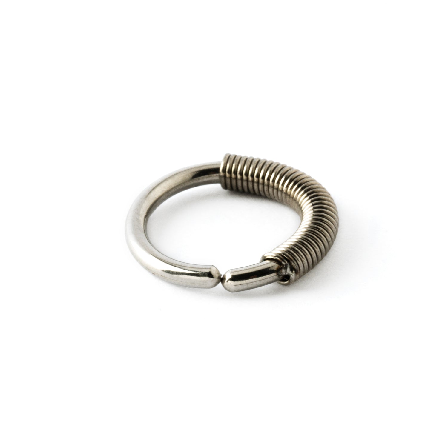 surgical steel seamless piercing ring with coiled wire ornament close up side view