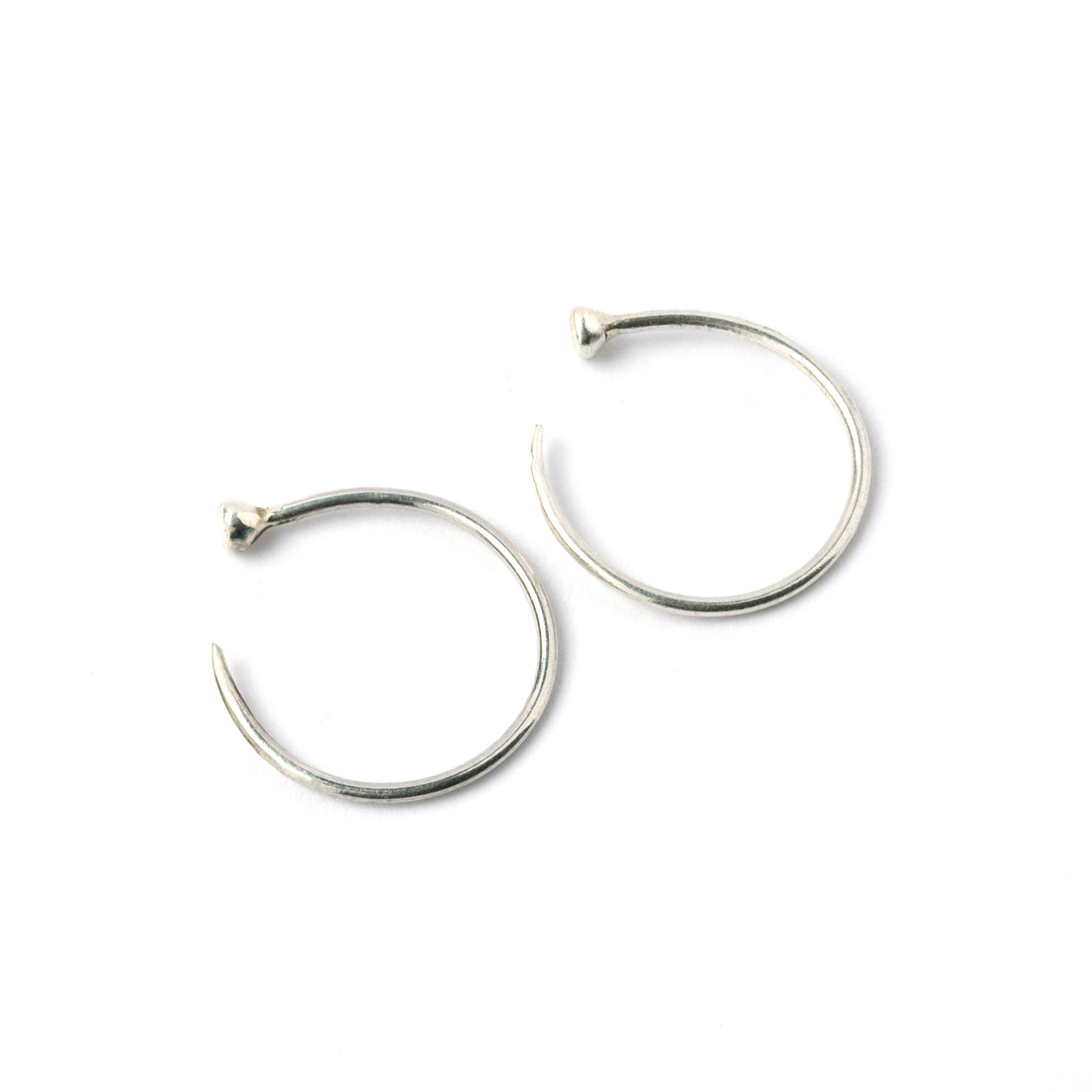 pair of open hoop silver wire earrings side view