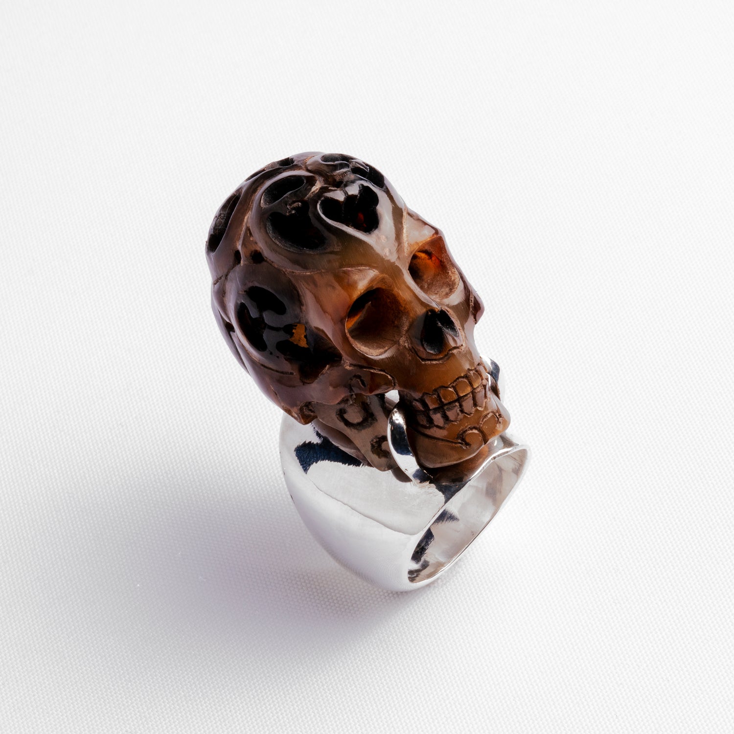 Carved skull and silver ring