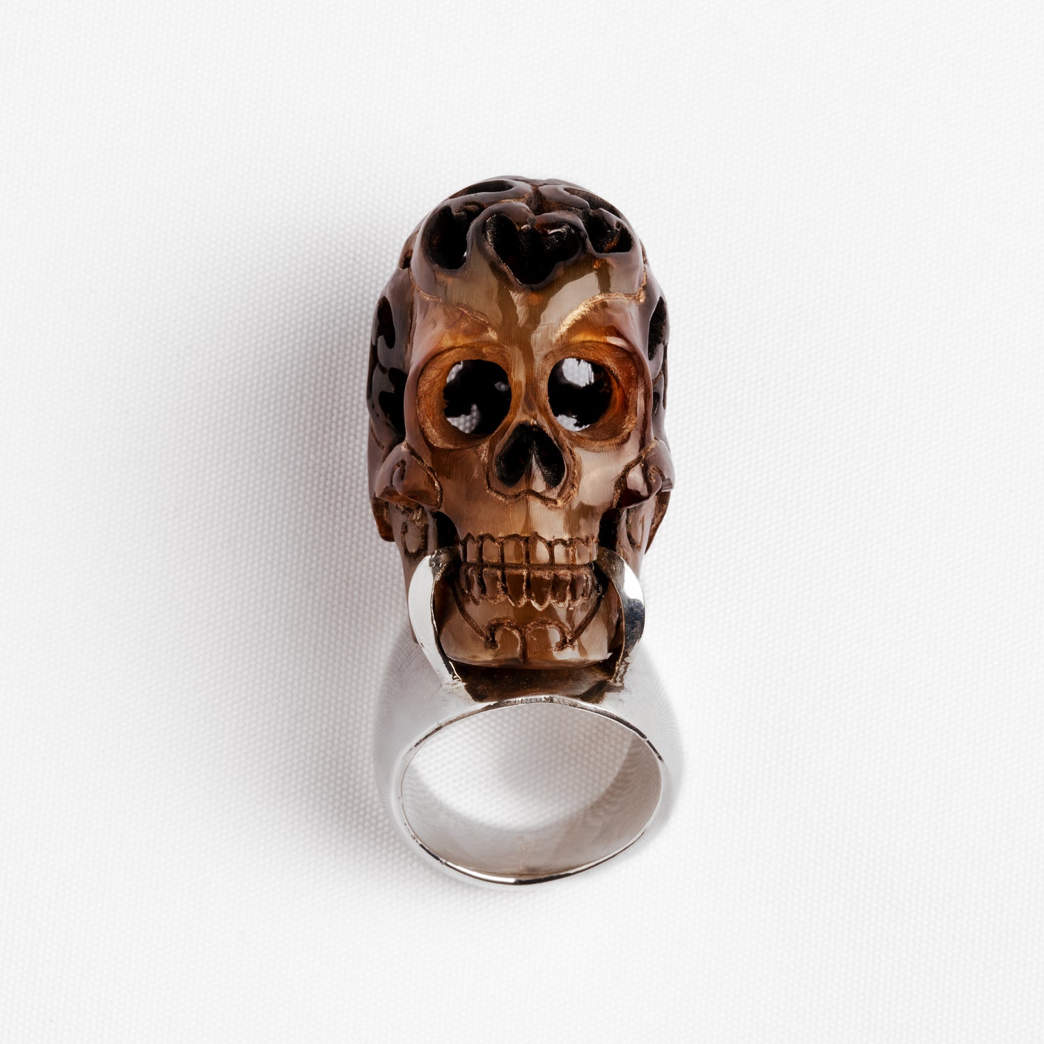 Carved skull and silver ring