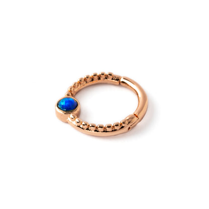 Rose gold Dayaa septum clicker with blue Opal left side view