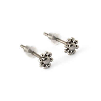 pair of surgical steel flower stud earrings front right view 