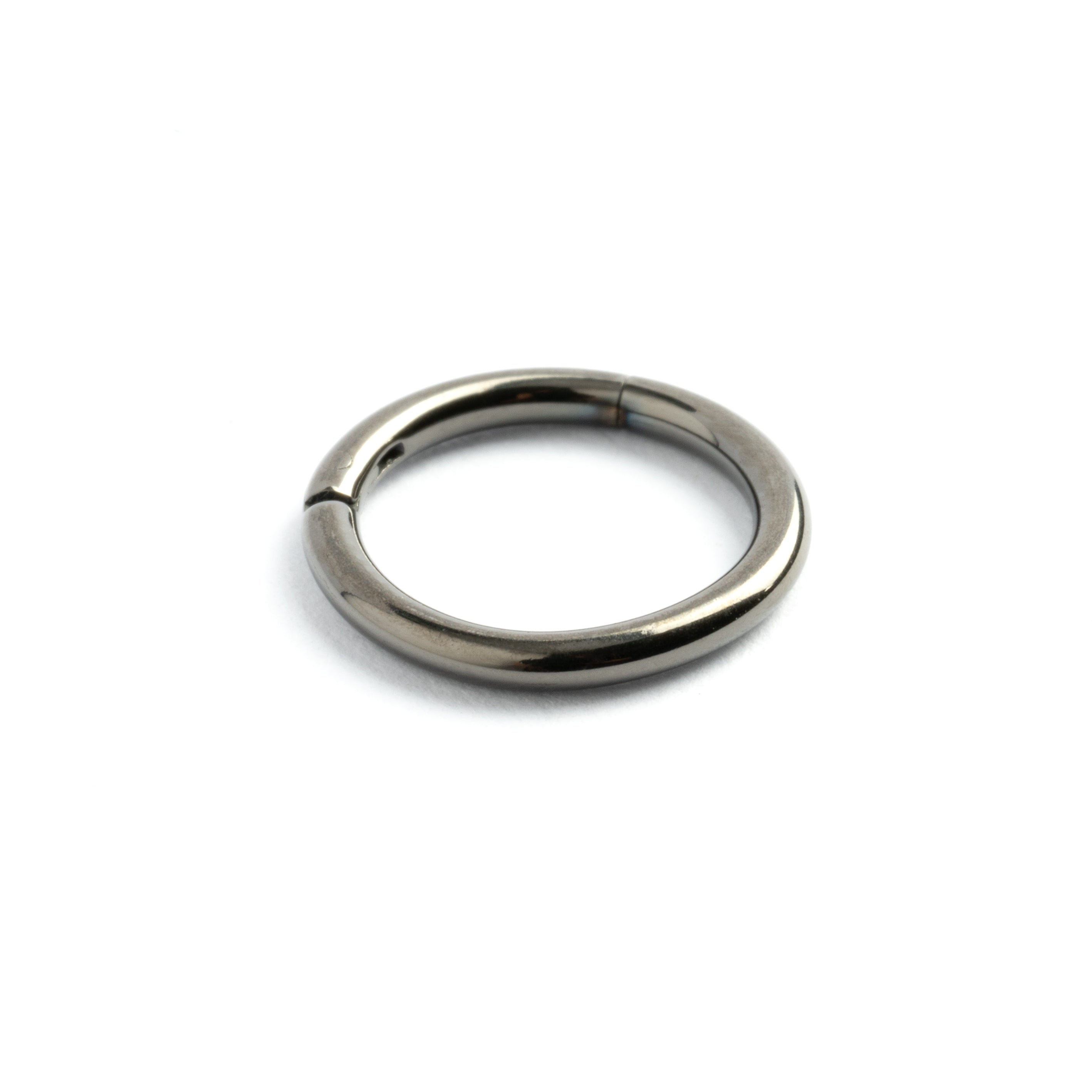 Dark steel clicker piercing ring side view