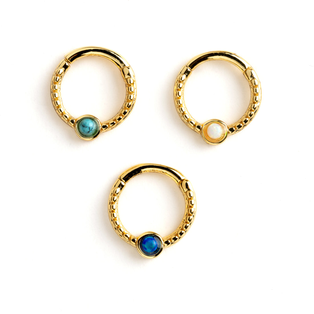 Dayaa gold surgical steel septum clicker with blue opal, white opal and turquoise frontal view