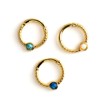 Dayaa gold surgical steel septum clicker with blue opal, white opal and turquoise frontal view