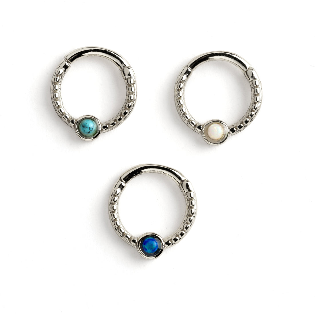 Dayaa surgical steel septum clicker with blue opal, white opal and turquoise frontal view