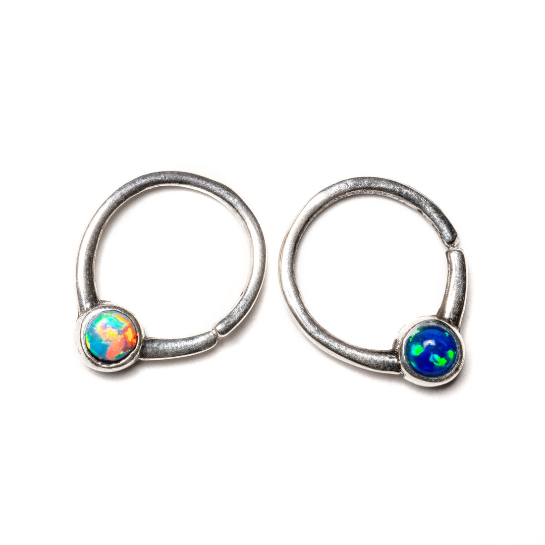 Devika silver septum ring with white and blue Opals frontal view