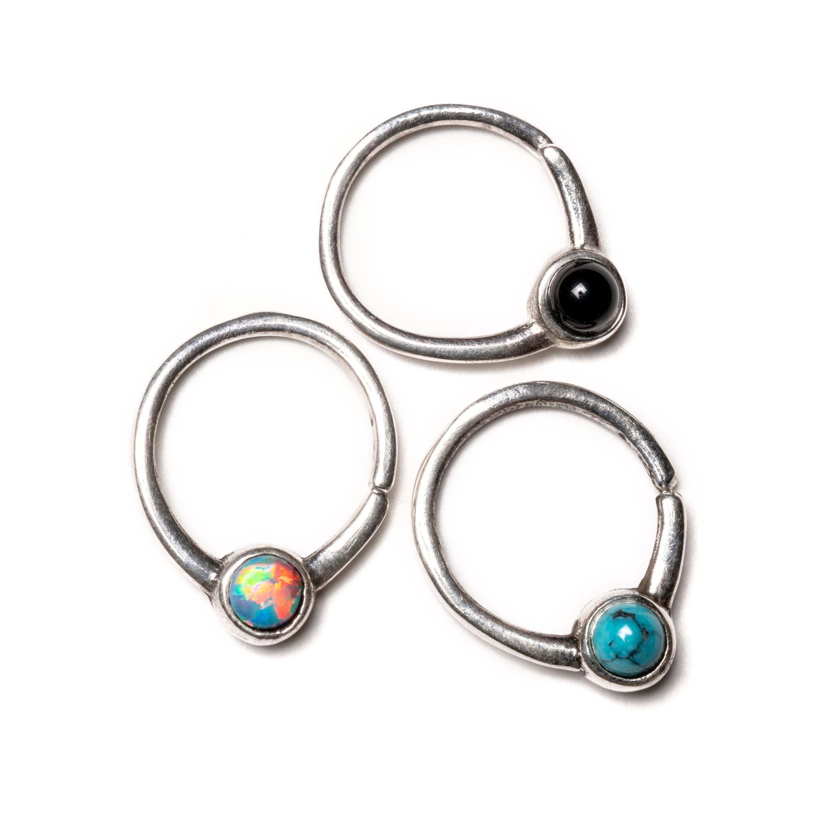 Devika silver septum ring with white and blue Opals, black onyx frontal view